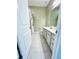 Bathroom featuring double sink vanity, tiled floors, and a shower with curtain at 648 Bloom Ter, Davenport, FL 33836