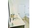 Bright bathroom with double sinks and a quartz countertop provides a sleek, modern aesthetic at 648 Bloom Ter, Davenport, FL 33836