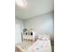 Bright bedroom with cube storage, comfortable bed, and carpet flooring at 648 Bloom Ter, Davenport, FL 33836