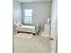 Comfortable bedroom featuring natural lighting from the window and carpet flooring at 648 Bloom Ter, Davenport, FL 33836