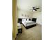 Serene bedroom featuring a dark bed frame, soft lighting and calming decor at 648 Bloom Ter, Davenport, FL 33836