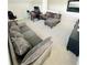 Upstairs bonus room with lots of seating and gaming setup at 648 Bloom Ter, Davenport, FL 33836