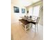 Bright dining area features modern decor, a comfortable bench seat, and neutral finishes at 648 Bloom Ter, Davenport, FL 33836