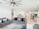 Expansive open-concept living area with modern furnishings and easy access to kitchen and hallway at 648 Bloom Ter, Davenport, FL 33836