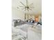 Spacious living room with modern furnishings and a stylish ceiling fan at 648 Bloom Ter, Davenport, FL 33836