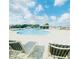 Beautiful community pool featuring lounge chairs, a covered picnic area, and expansive sundeck for residents enjoyment at 648 Bloom Ter, Davenport, FL 33836