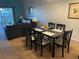 Open-concept dining area flowing into the living space with access to the balcony for outdoor enjoyment at 705 Gran Bahama Blvd # 705, Davenport, FL 33897
