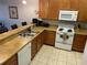 Efficient kitchen with a breakfast bar, featuring modern appliances and ample counter space at 705 Gran Bahama Blvd # 705, Davenport, FL 33897