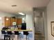 Well-lit kitchen with a breakfast bar, oak cabinets, and modern appliances for easy meal preparation at 705 Gran Bahama Blvd # 705, Davenport, FL 33897