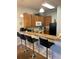 Charming kitchen featuring a breakfast bar with bar stool seating and essential appliances at 705 Gran Bahama Blvd # 705, Davenport, FL 33897