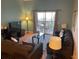 Inviting living room with balcony access offering outdoor views and comfortable seating for relaxation at 705 Gran Bahama Blvd # 705, Davenport, FL 33897