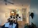 Cozy living room with a ceiling fan, comfortable seating, and a breakfast bar leading to a quaint kitchen at 705 Gran Bahama Blvd # 705, Davenport, FL 33897