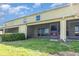 Spacious backyard featuring a covered patio and well-maintained lawn, ideal for outdoor enjoyment at 380 Arbor Lakes Dr, Davenport, FL 33896
