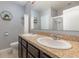 Well-appointed bathroom with double sinks, and an enclosed glass shower at 380 Arbor Lakes Dr, Davenport, FL 33896
