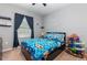 Fun bedroom with playful decor, natural light, and a cozy feel at 380 Arbor Lakes Dr, Davenport, FL 33896