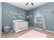 Charming Bedroom with a floral crib design, soft pink rug, and elegant wall decor at 380 Arbor Lakes Dr, Davenport, FL 33896