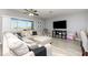 Bright living room with comfortable seating and a view of the water at 380 Arbor Lakes Dr, Davenport, FL 33896