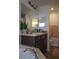 Bathroom vanity with dual mirrors and a garden tub at 512 Central Ridge Ln, Frostproof, FL 33843