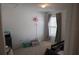 Bright bedroom with a window, closet, carpeted floor, and gray curtains at 512 Central Ridge Ln, Frostproof, FL 33843