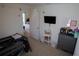 Cozy bedroom featuring neutral walls, carpeted floors, and a gray toddler bed at 512 Central Ridge Ln, Frostproof, FL 33843