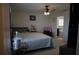 Bedroom view to ensuite bathroom with a ceiling fan at 512 Central Ridge Ln, Frostproof, FL 33843