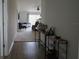 Hallway featuring light wood floors, and a view into a living room with lots of natural light at 512 Central Ridge Ln, Frostproof, FL 33843
