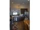 Kitchen featuring dark cabinets, granite countertops, and stainless steel appliances at 512 Central Ridge Ln, Frostproof, FL 33843