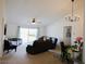 Living room with carpet floors, ceiling fan, and lots of natural light at 512 Central Ridge Ln, Frostproof, FL 33843