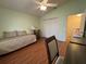 Bedroom with hardwood floors and a ceiling fan at 992 Davit Pl, The Villages, FL 32162