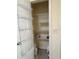 Walk-in pantry with shelving on the door and walls at 992 Davit Pl, The Villages, FL 32162
