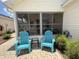 Outdoor patio with brick pavers and chairs at 992 Davit Pl, The Villages, FL 32162