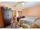 Bedroom featuring a wardrobe, dresser, TV, bedside table, and recliner chair at 12313 Citruswood Dr, Orlando, FL 32832