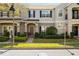 Charming townhome featuring blue shutters, a well-manicured lawn and a welcoming front entrance at 12313 Citruswood Dr, Orlando, FL 32832