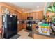 Well-equipped kitchen with dark appliances, wooden cabinets, and plenty of workspace at 12313 Citruswood Dr, Orlando, FL 32832