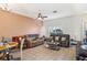 Spacious living room with tile floors, ceiling fan, and comfortable seating arrangement at 12313 Citruswood Dr, Orlando, FL 32832