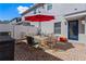 Outdoor patio features a brick surface, patio dining set with umbrella, and blue exterior door at 12313 Citruswood Dr, Orlando, FL 32832