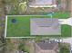 An aerial view shows a house with a fenced yard, a trampoline, and an above-ground pool at 1426 Powhatan Ct, Lakeland, FL 33805
