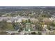 A home highlighted from an aerial perspective, features a fenced backyard, landscaping and neighborhood setting at 1426 Powhatan Ct, Lakeland, FL 33805