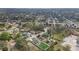 An aerial view showing a home with a fenced backyard and a residential neighborhood at 1426 Powhatan Ct, Lakeland, FL 33805
