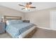 Bedroom with ceiling fan, a bed with storage, and bright natural light at 1426 Powhatan Ct, Lakeland, FL 33805