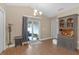 Dining area featuring sliding glass doors to outdoor patio and stylish hutch for convenient storage at 1426 Powhatan Ct, Lakeland, FL 33805