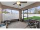 Enclosed porch with windows overlooking the backyard at 1426 Powhatan Ct, Lakeland, FL 33805