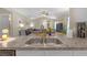 Open concept kitchen with wood floors and stainless steel appliances overlooking the living room at 1426 Powhatan Ct, Lakeland, FL 33805