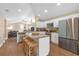 Bright open concept kitchen with an island, stainless steel appliances and white cabinetry at 1426 Powhatan Ct, Lakeland, FL 33805