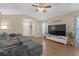 Spacious living room with wood flooring, a vaulted ceiling, a ceiling fan, and lots of natural light at 1426 Powhatan Ct, Lakeland, FL 33805