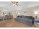 Comfortable living room featuring wood flooring, a vaulted ceiling, and gray furnishings at 1426 Powhatan Ct, Lakeland, FL 33805