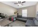 Home office boasts a large desk, ample seating, a ceiling fan and bright light from the window at 1426 Powhatan Ct, Lakeland, FL 33805