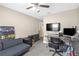 Office/flex space features a futon, work station with dual monitors and is well illuminated with a ceiling fan at 1426 Powhatan Ct, Lakeland, FL 33805