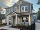 Charming two-story home featuring a covered front porch and well-maintained landscaping at 1630 Haven Dr, Orlando, FL 32803