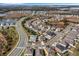 This aerial view captures the charm of this neighborhood and home near a scenic lake and fountain at 3214 Bayou Bay Dr, Lakeland, FL 33811